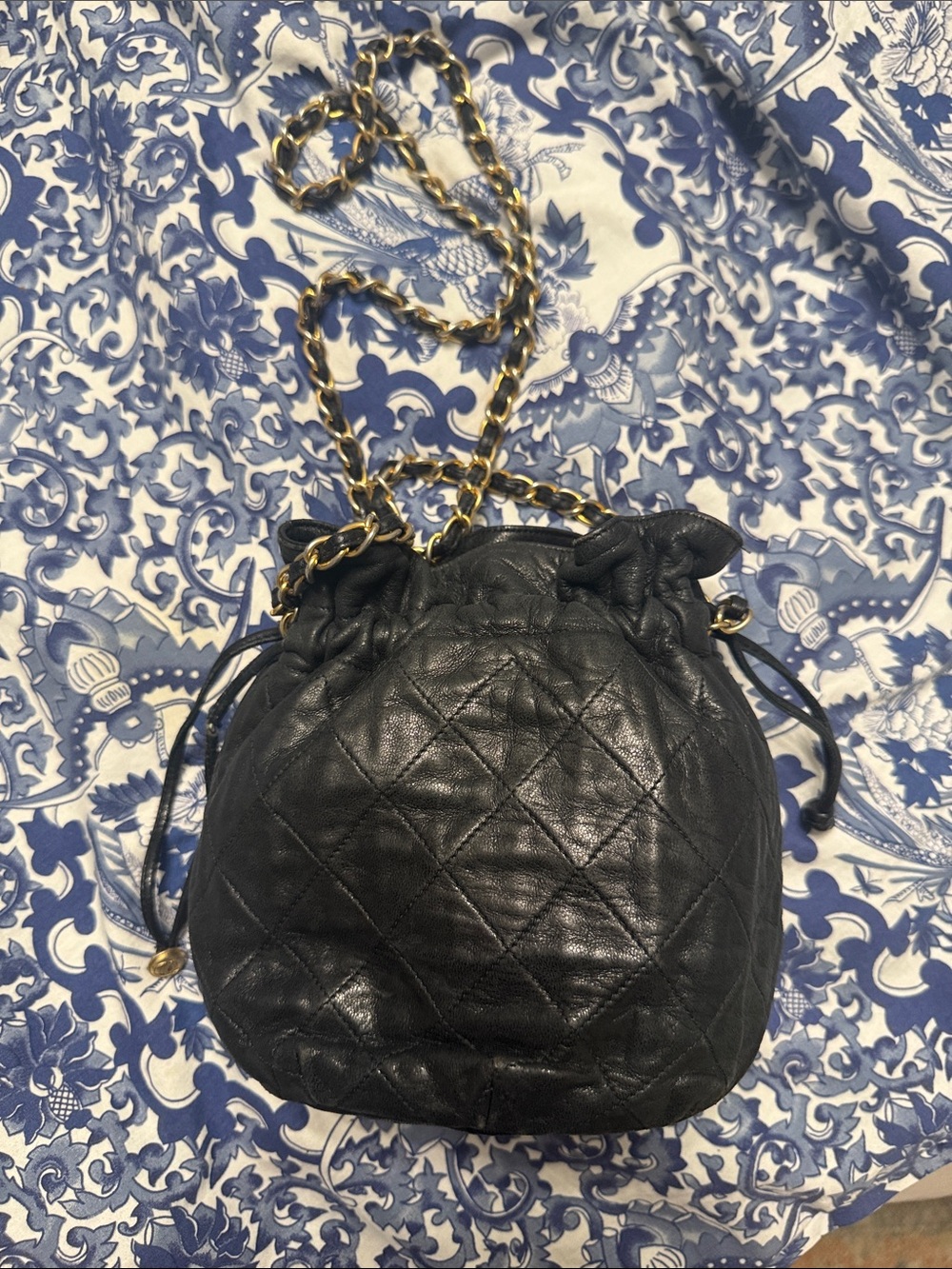 CHANEL Black Quilted Leather Drawstring Mini Shoulder Bag with Gold Chain